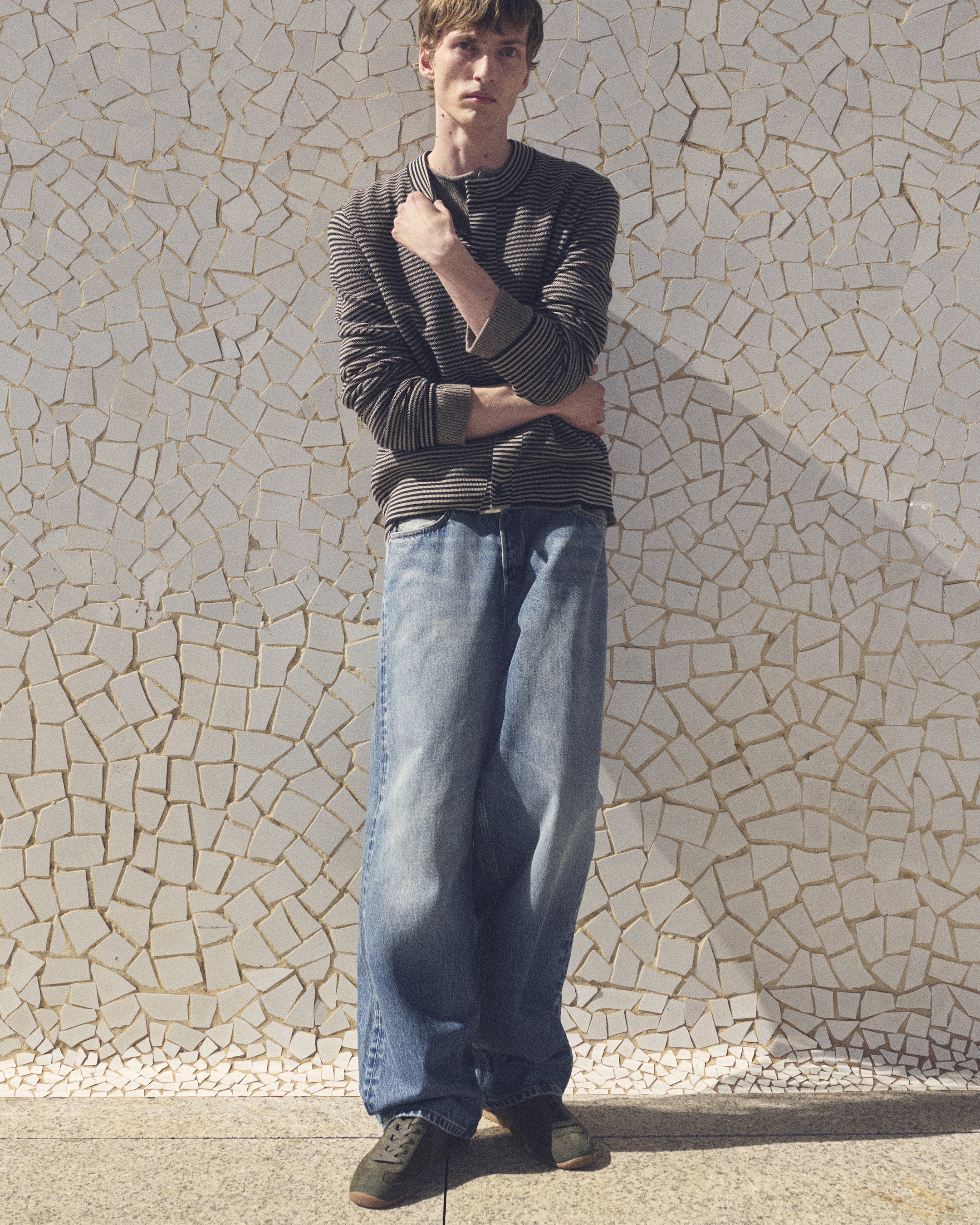 man in the stripe top