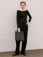 Placeholder for: Women in jumper and bag