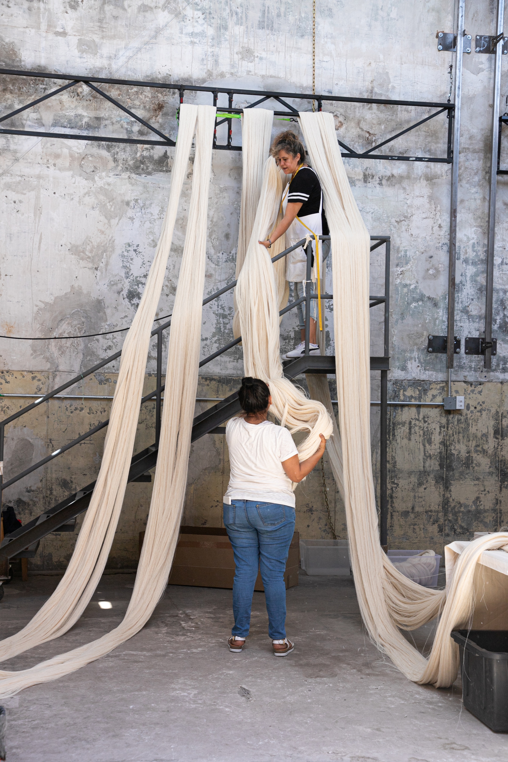 people building art installation