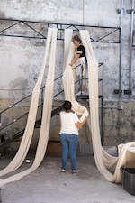 Placeholder for: people building art installation