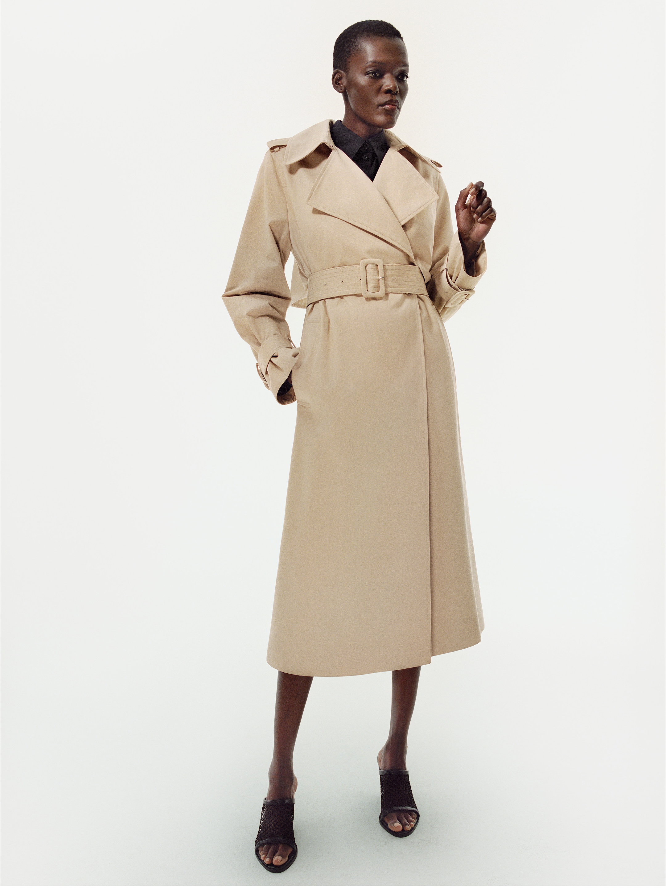 Person wearing coat by COS