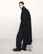 Placeholder for: Man in black jacket and shoes and jacket desktop