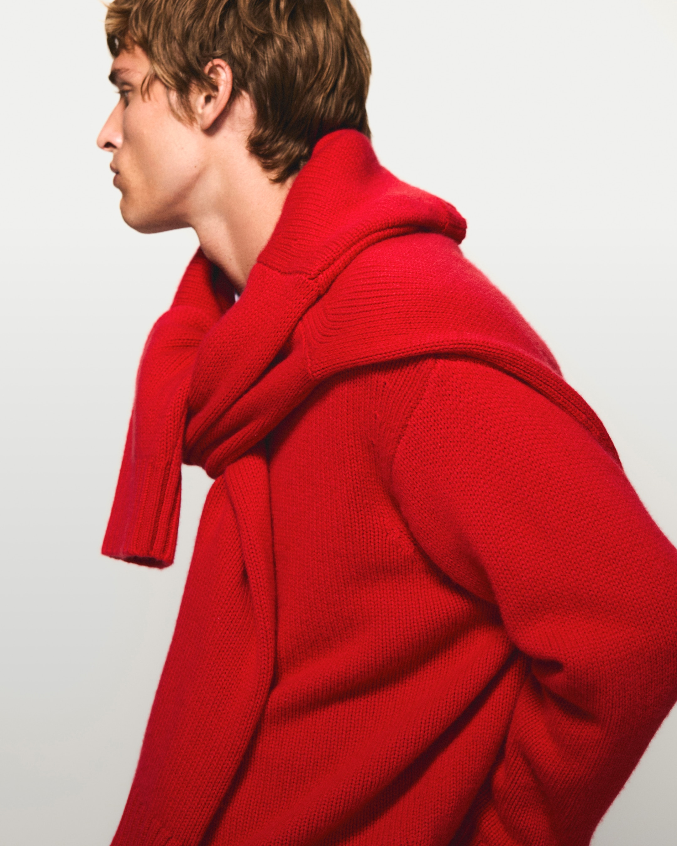 Red sweater and wrapped around neck