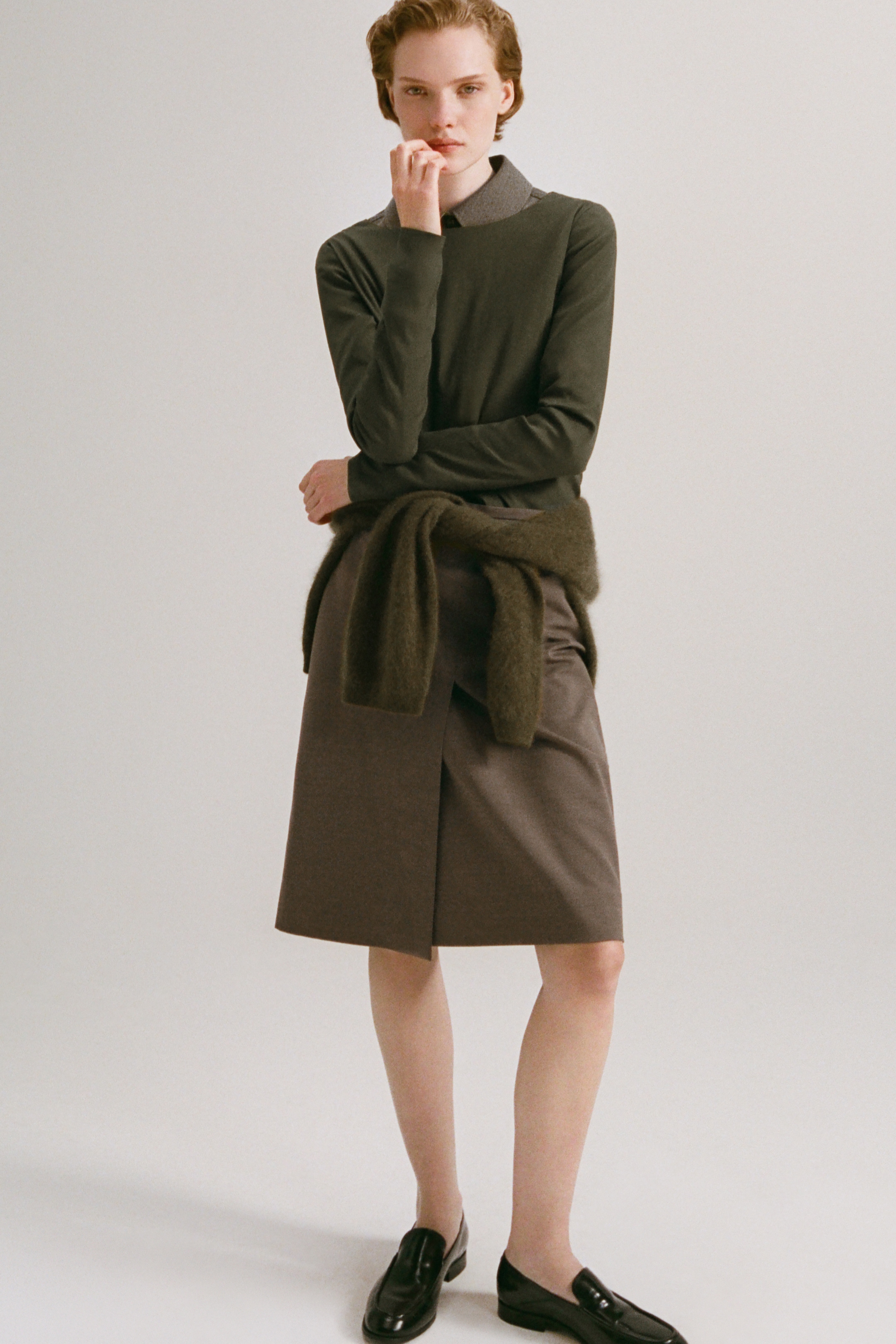 Women in olive top and skirt