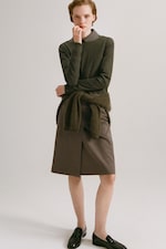 Placeholder for: Women in olive top and skirt