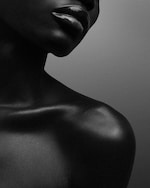 Placeholder for: Model with lip balm wearing perfume