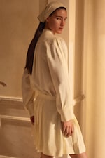 Placeholder for: woman in white shirt and skirt and head scarf