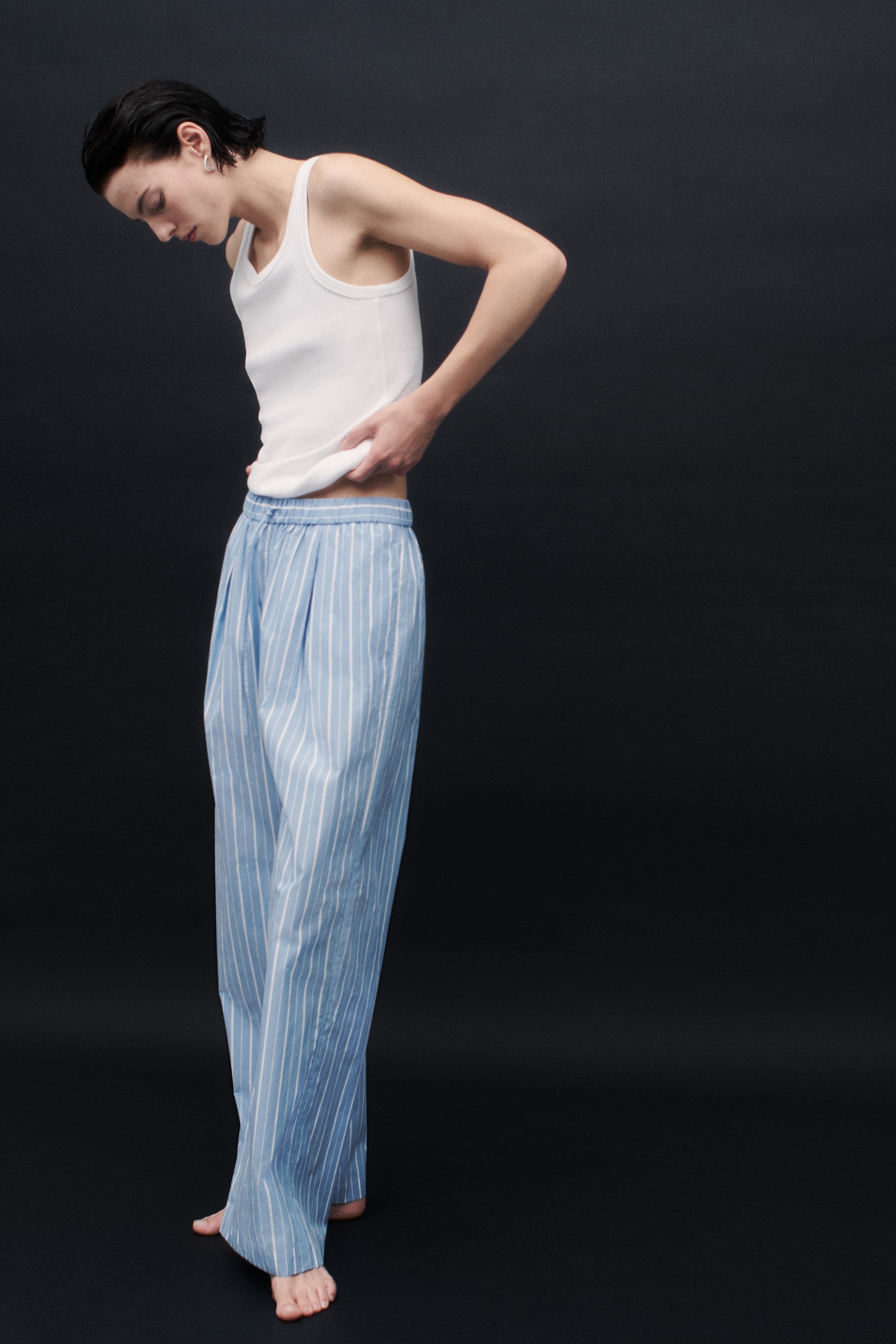 Person wearing blue trousers