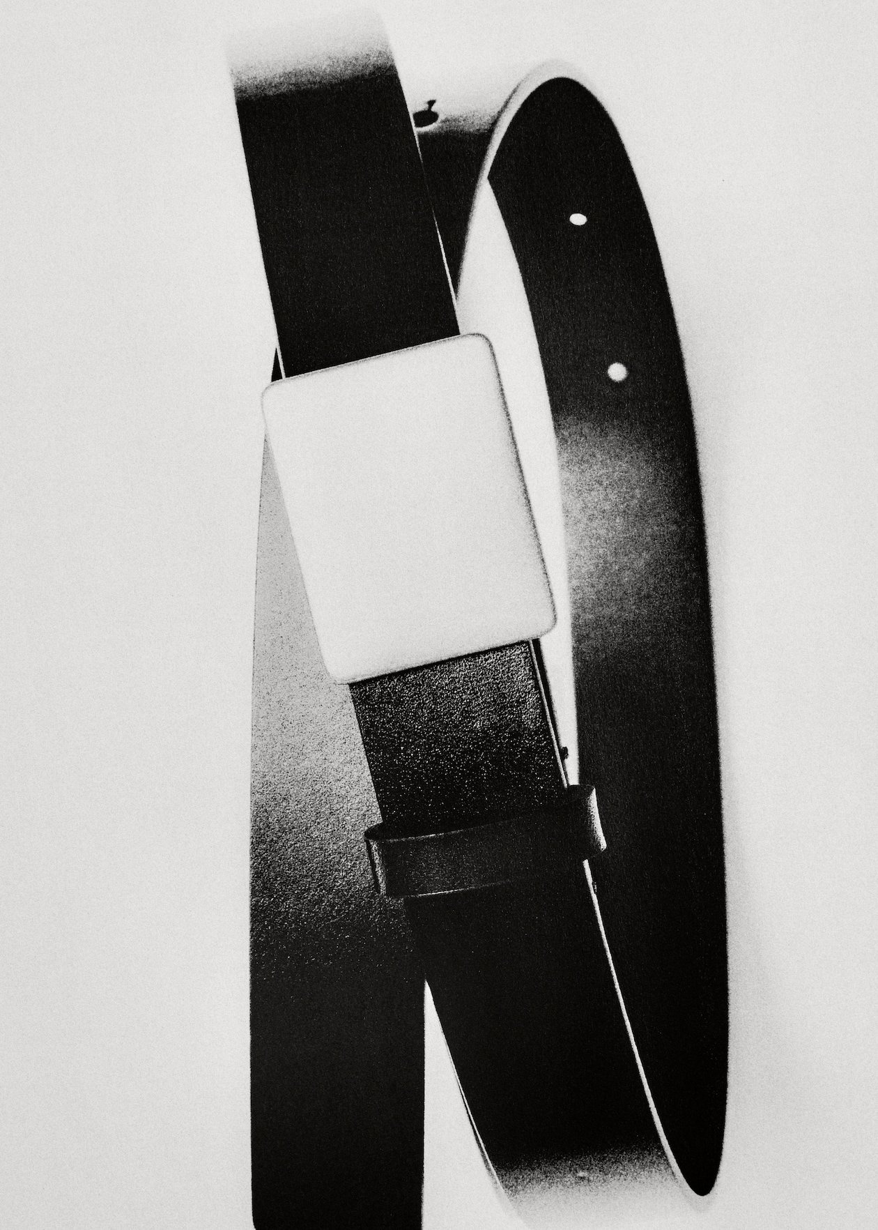 A black leather belt with a large rectangular buckle, shot in high contrast black and white.