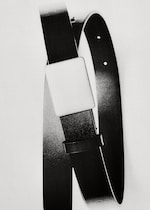 Placeholder for: A black leather belt with a large rectangular buckle, shot in high contrast black and white.