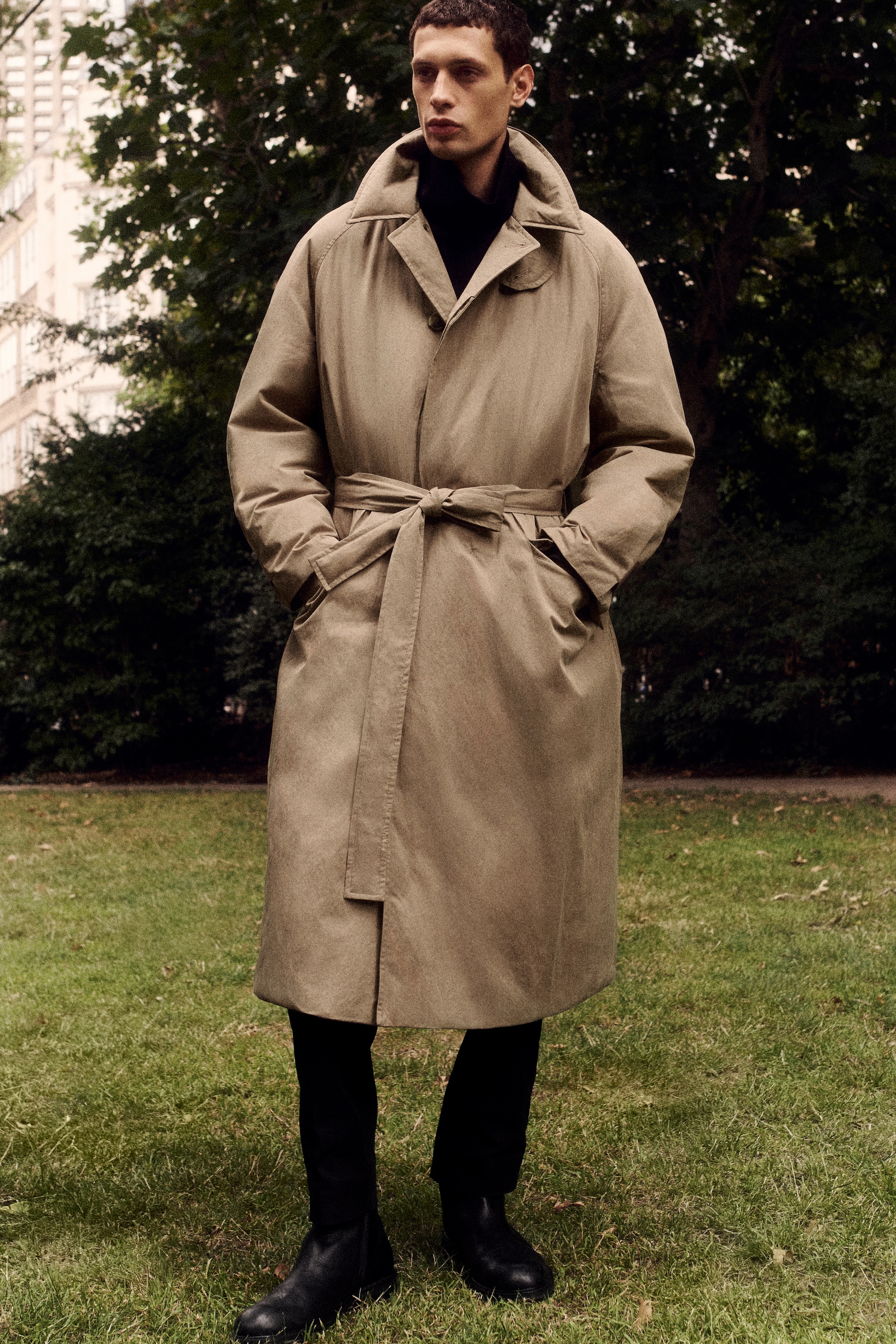 man in trench style puffer