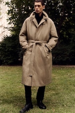 Placeholder for: man in trench style puffer