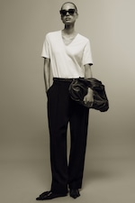 Placeholder for: Person wearing white t-shirt