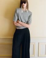Placeholder for: model wearing grey top and black trousers