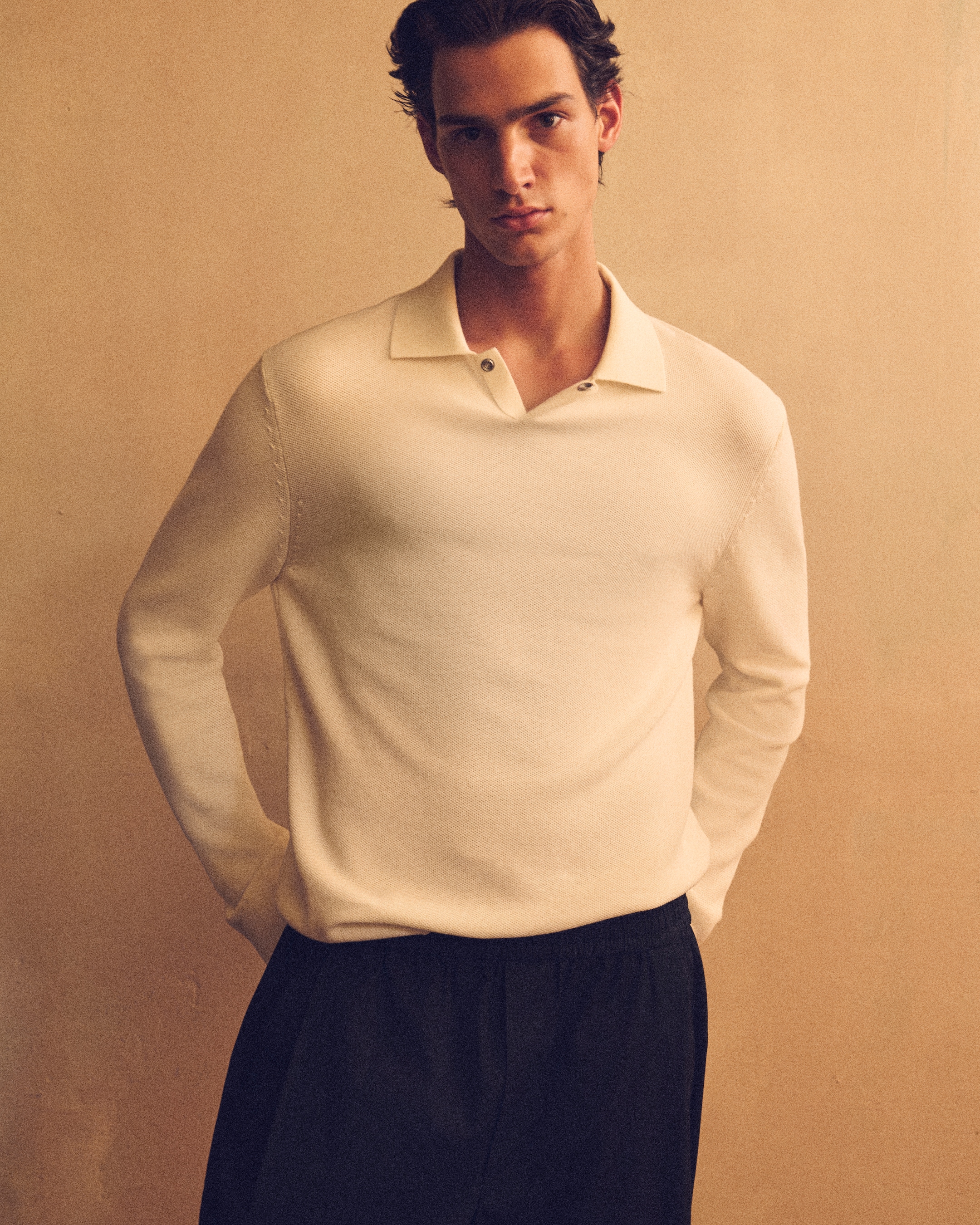 Man in white knitwear