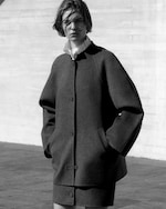 Placeholder for: Person wearing grey wool jacket