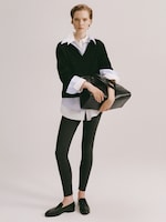 Placeholder for: Women in white shirt and jumper