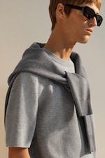 Placeholder for: model wearing grey T-shirt and sunglasses