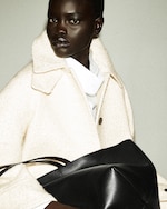 Placeholder for: person wearing white wool coat