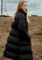 Placeholder for: Woman wearing puffer coat