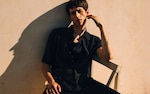 Placeholder for: Man sitting on chair in full black co-ord