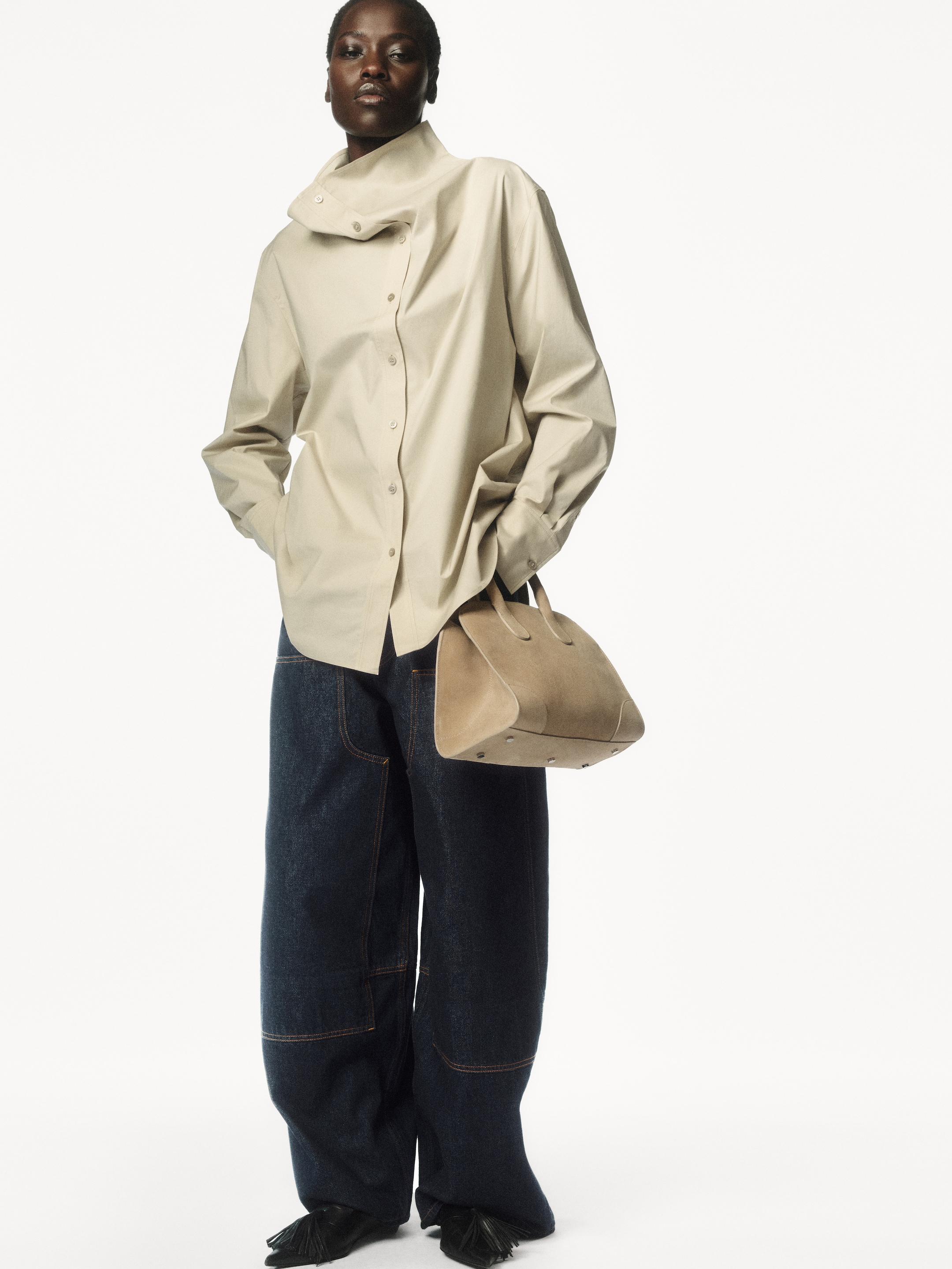 Person wearing beige jacket