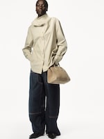 Placeholder for: Person wearing beige jacket