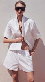 Placeholder for: woman in white shirt and shorts set