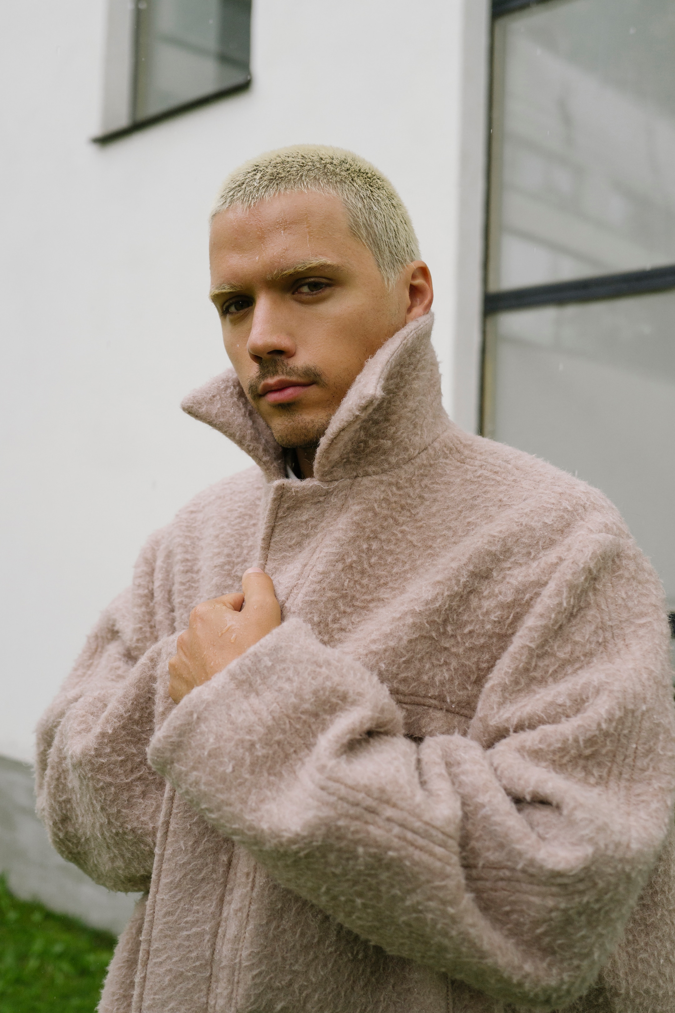 Harry Nuriev wears COS coat
