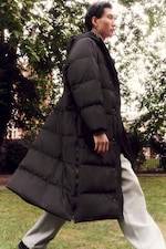 Placeholder for: man in long puffer coat