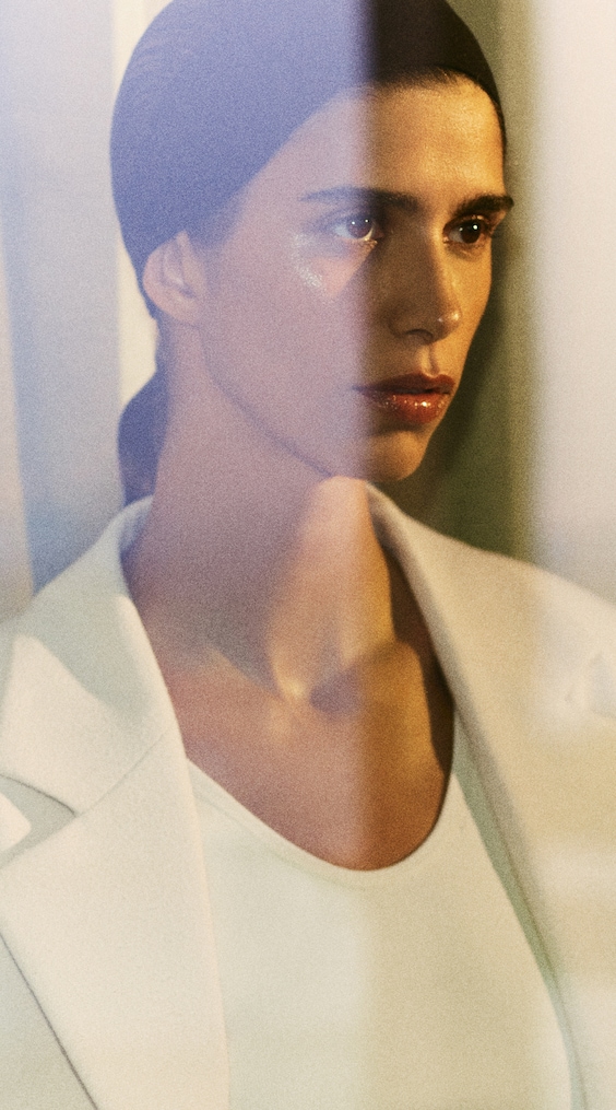 Model wearing white blazer