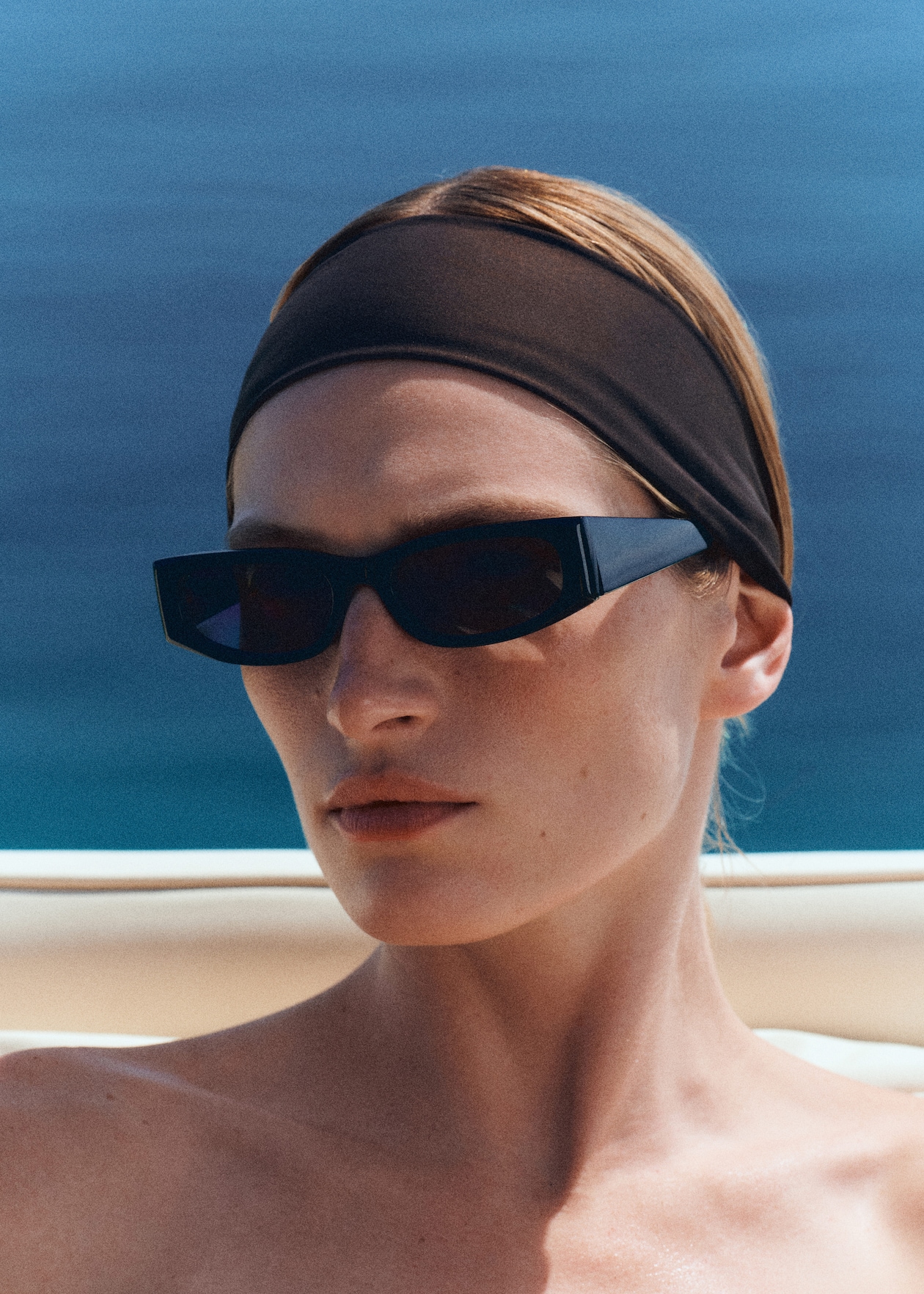 woman wearing black sunglasses and headband