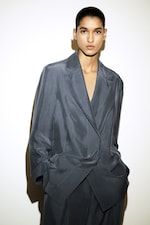 Placeholder for: woman in blue silk blazer suit