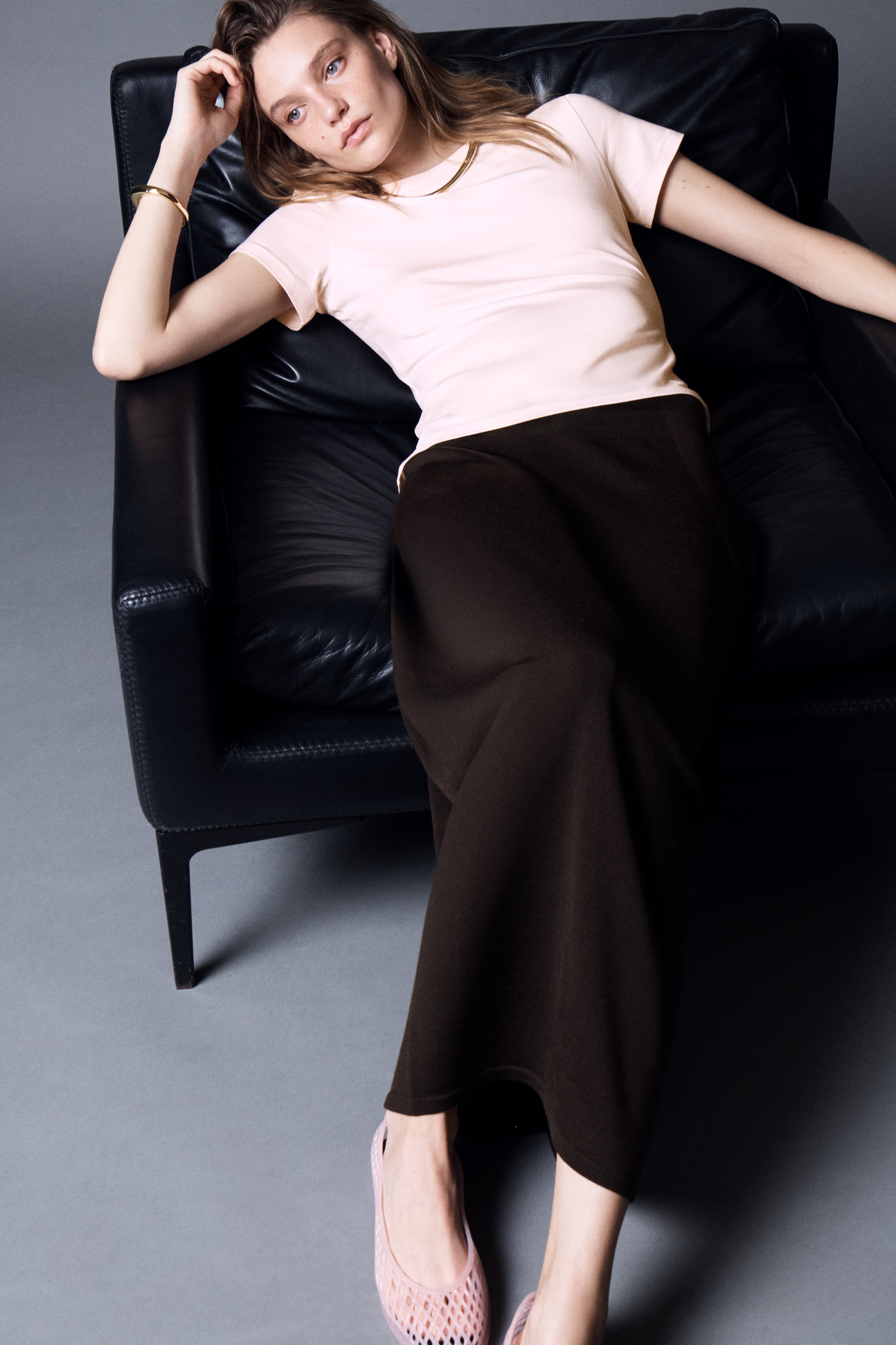 Person wearing pink t-shirt