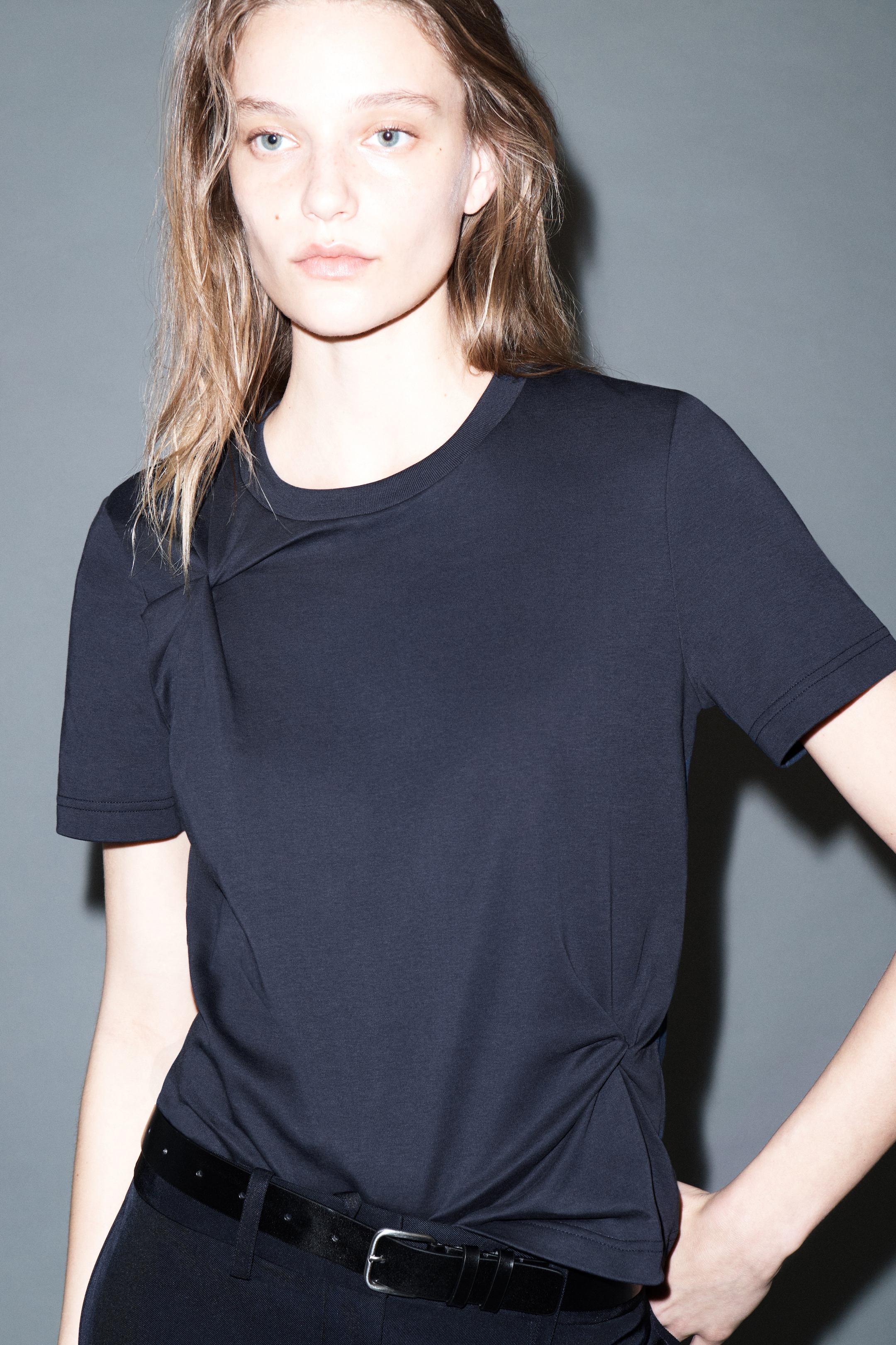 Person wearing blue navy t-shirt