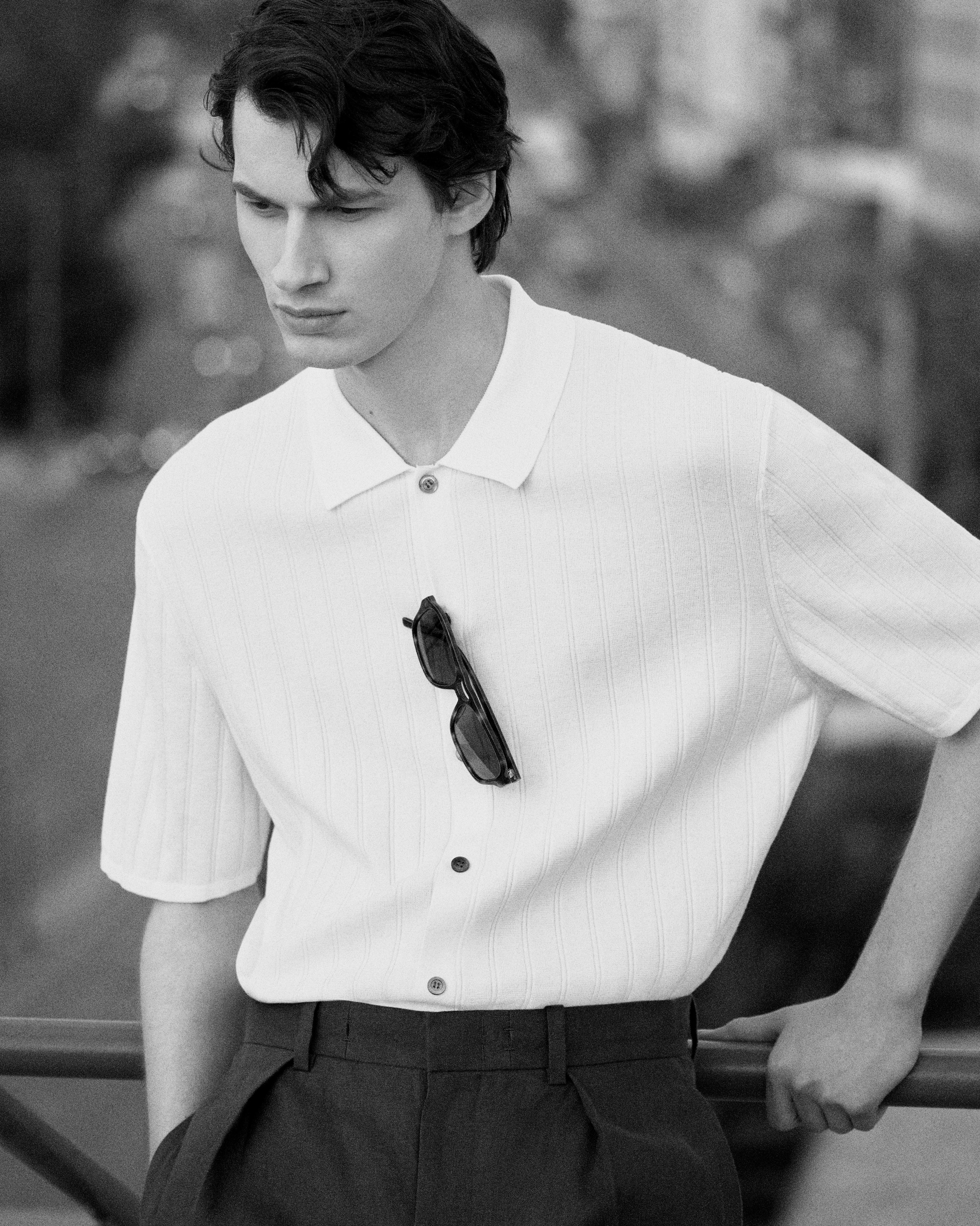 model wearing knitted polo shirt