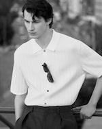 Placeholder for: model wearing knitted polo shirt