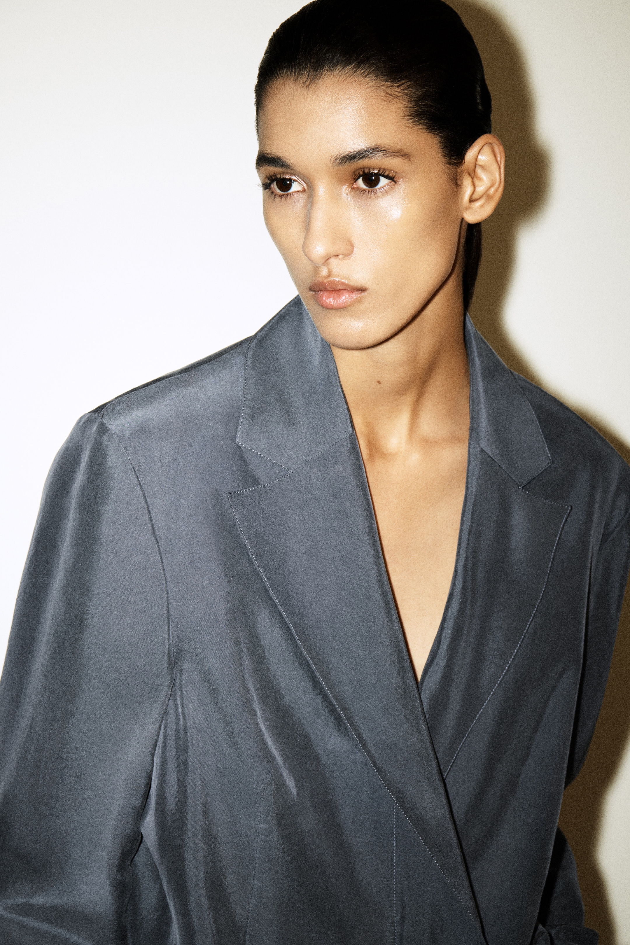 woman in blue silk blazer