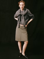 Placeholder for: Women in skirt and wool scarf