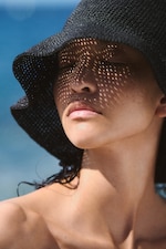 Placeholder for: woman in straw hat