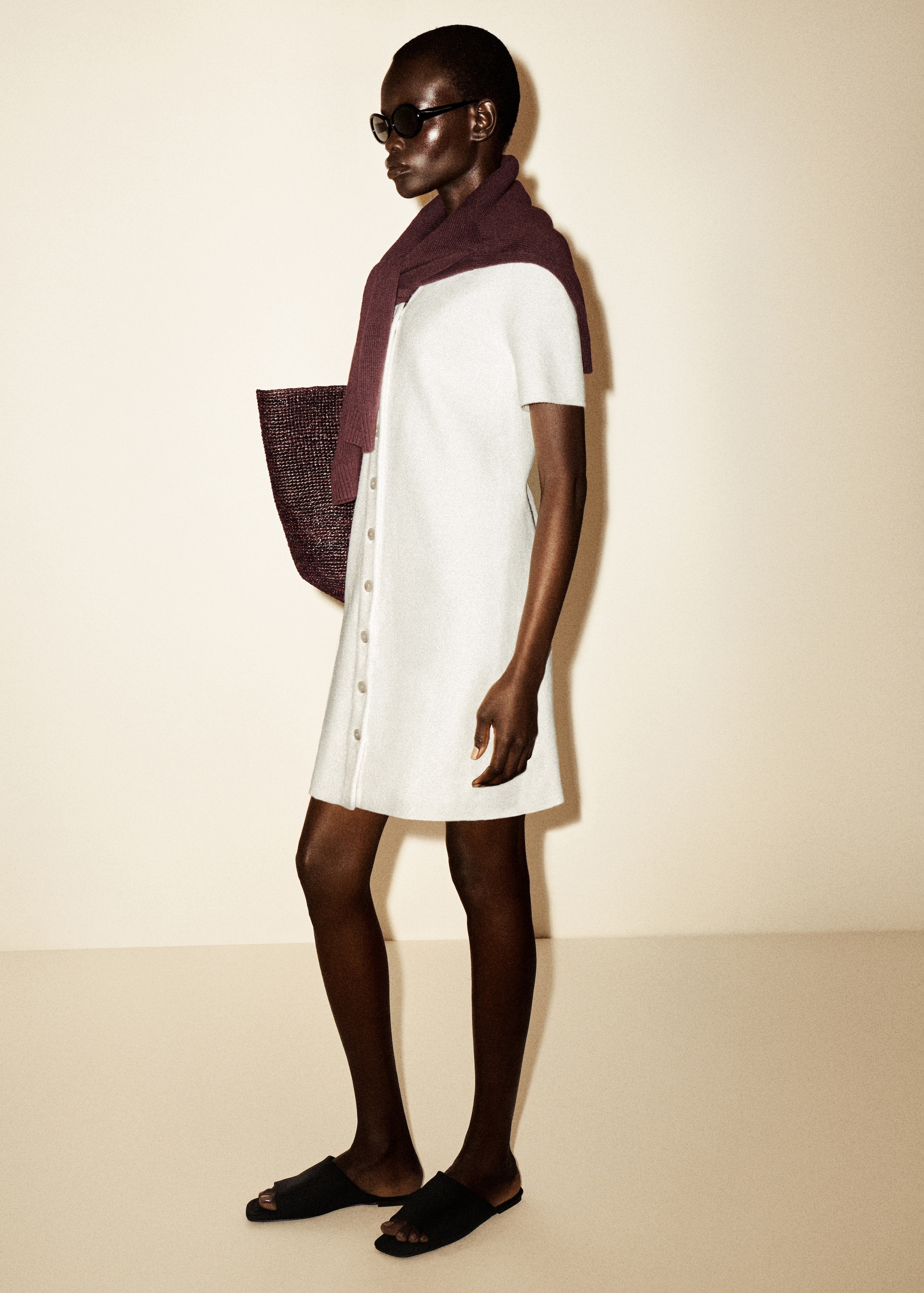 woman in white knitted mini dress