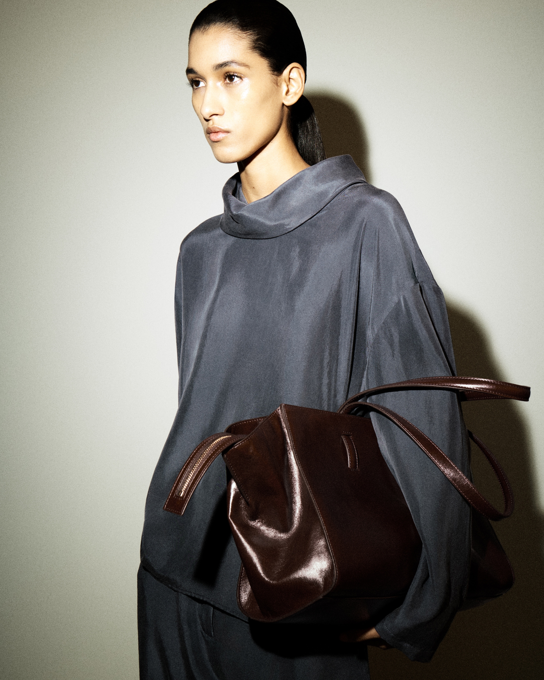 woman in blue silk top