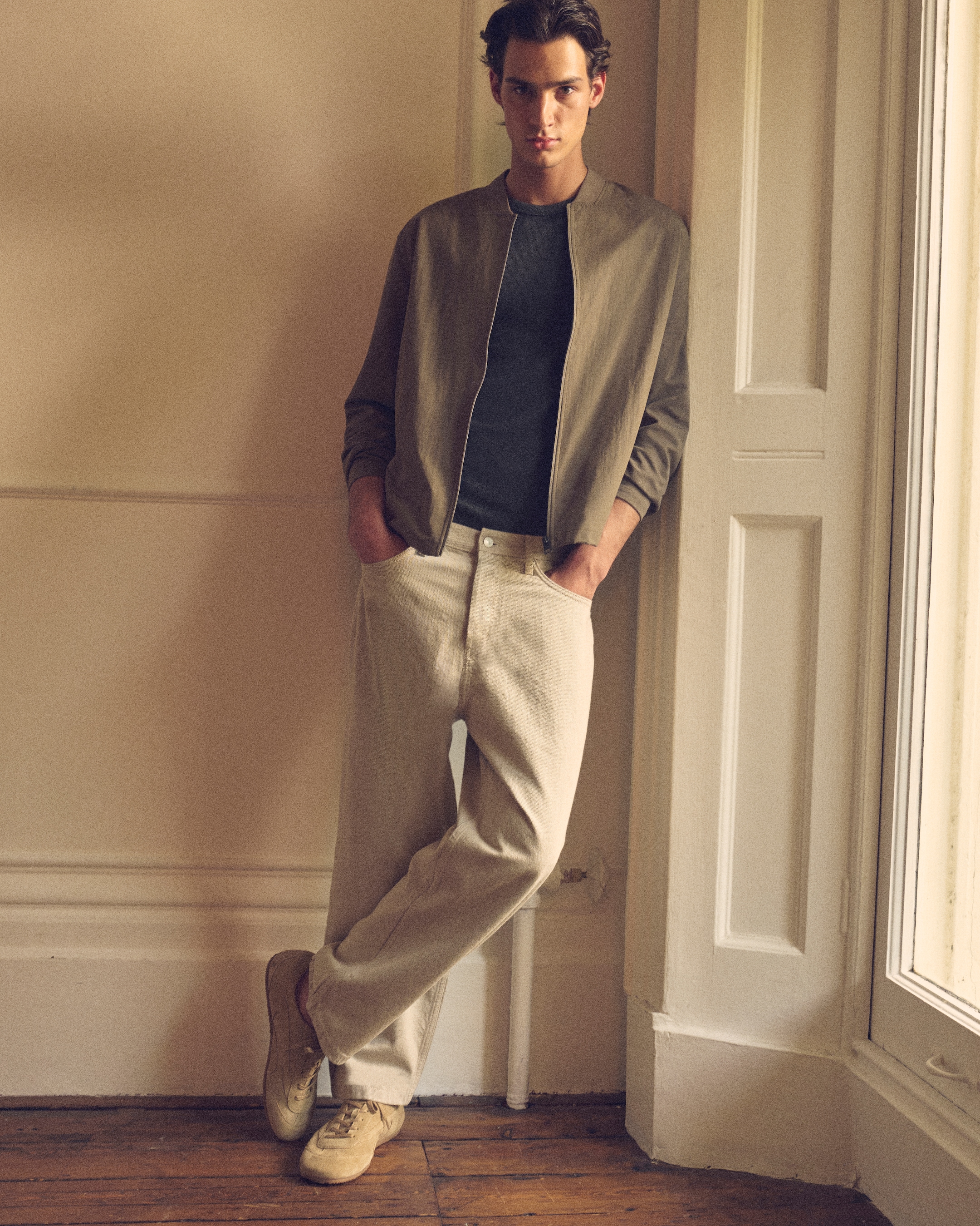 man in green jacket and trousers