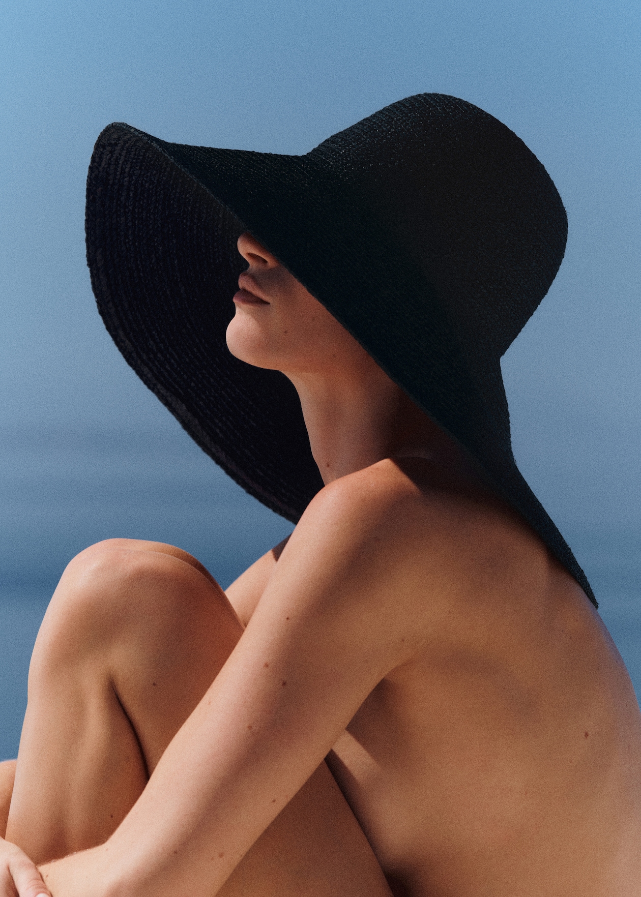 woman wearing black oversized hat