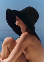 Placeholder for: woman wearing black oversized hat