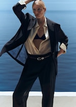 Placeholder for: women in swimsuit wearing black sheer outfit with a white shirt