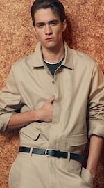 Placeholder for: man in coordinating beige shirt and trousers with belt