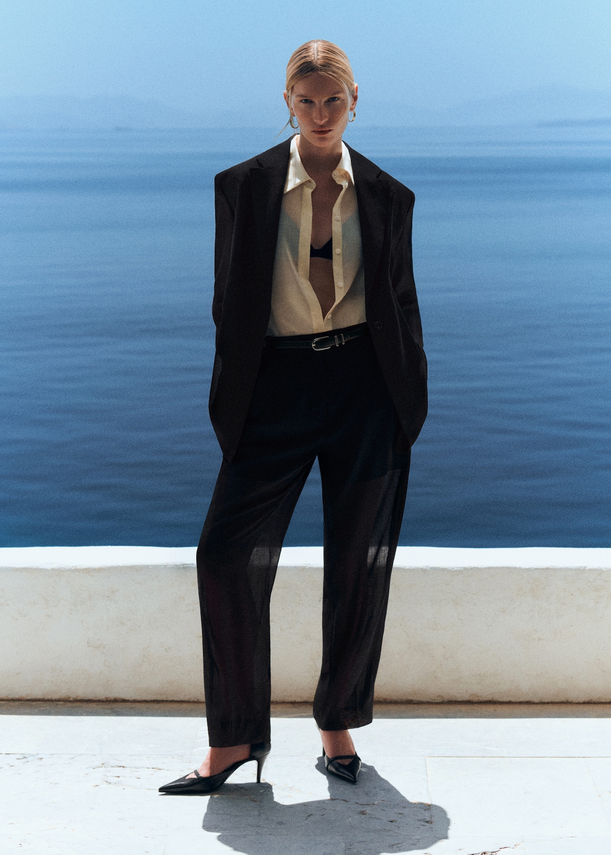 women in sheer suit