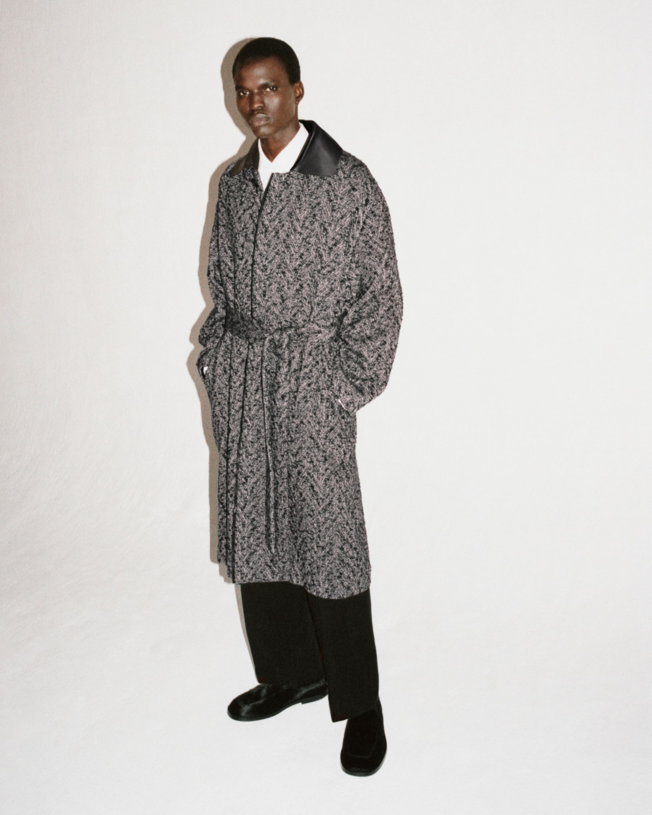 man in grey coat mob