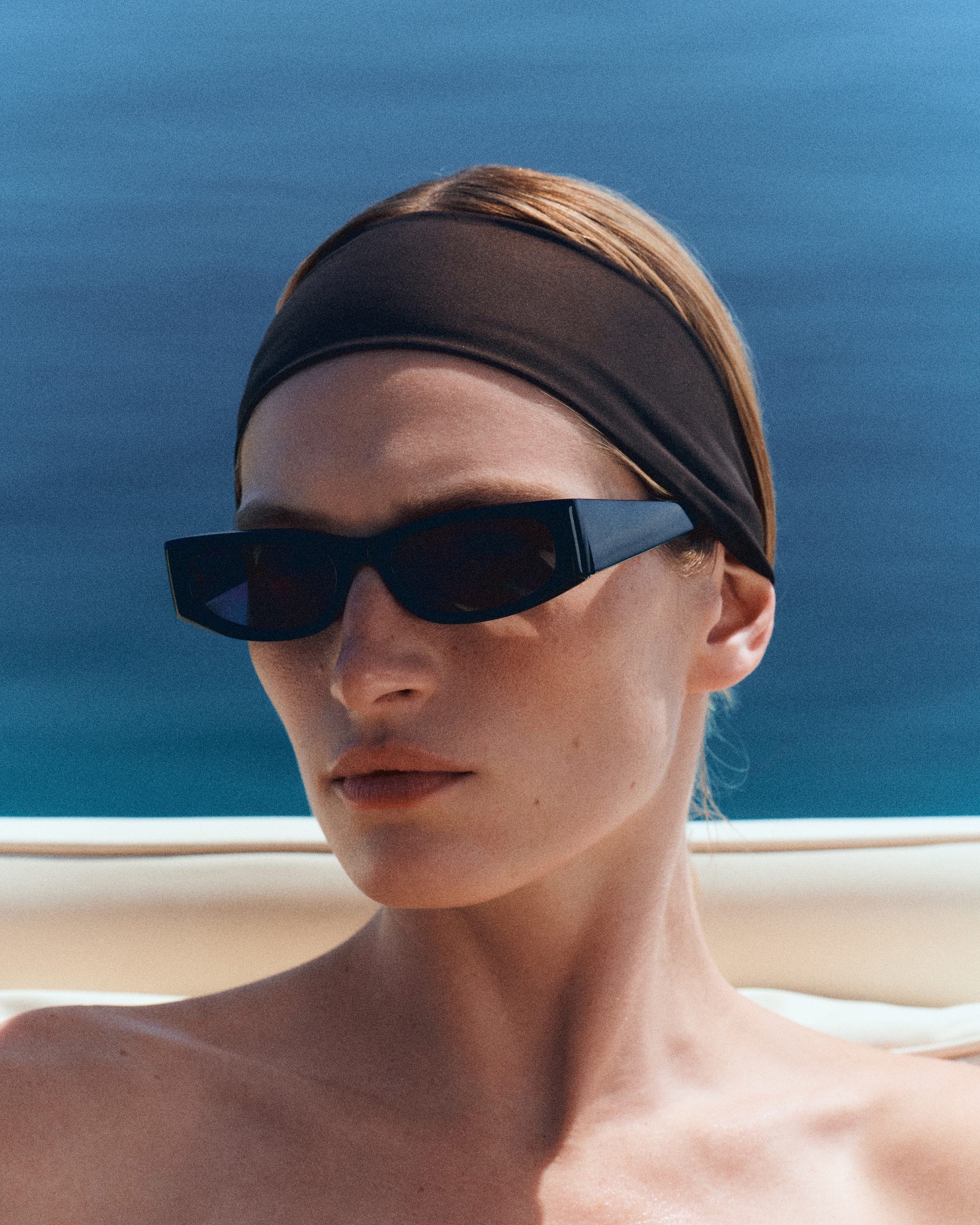 close up of woman in black sunglasses